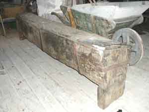 Long, ancient wooden chest on legs with a lockable lid